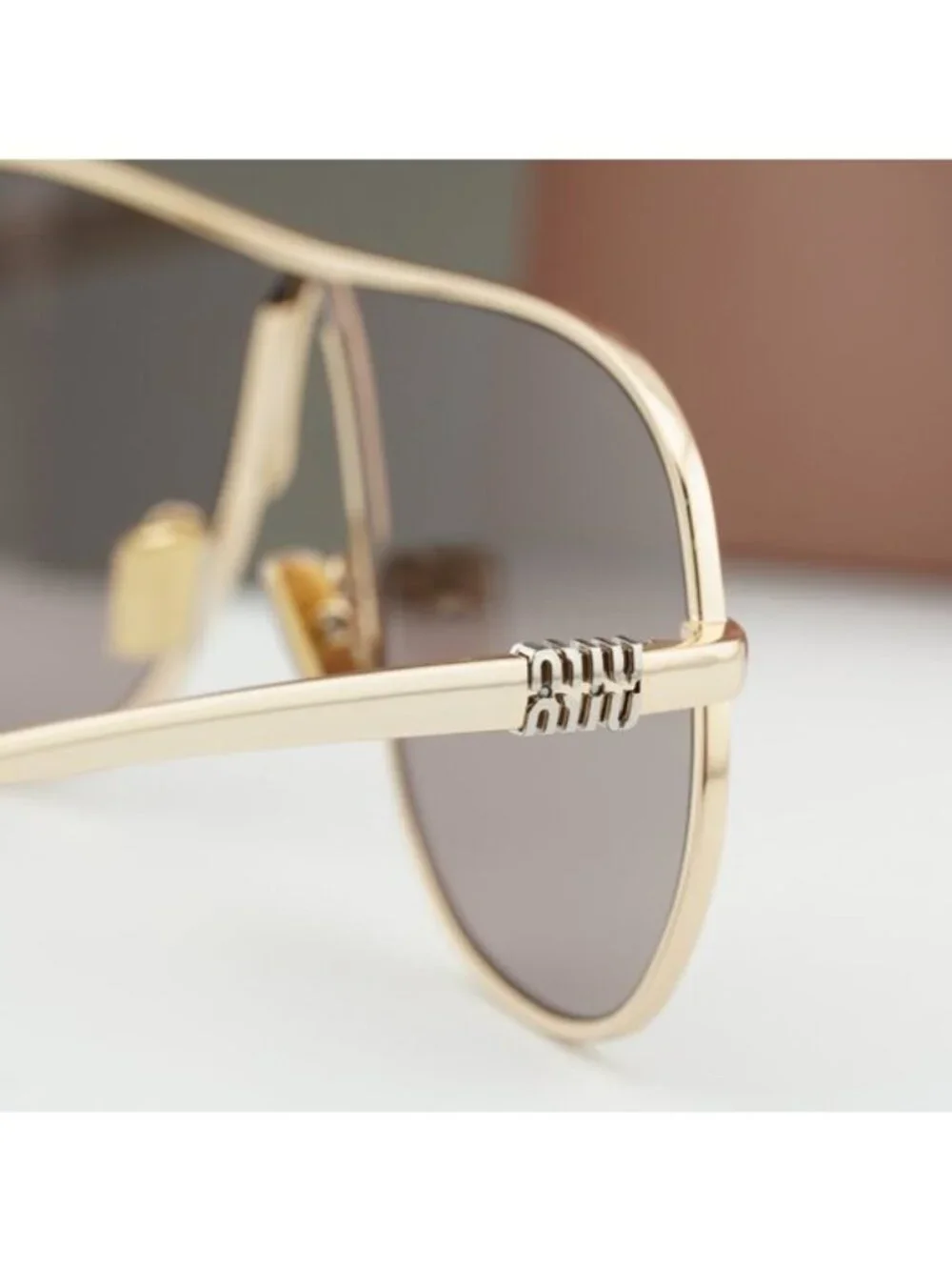 Miu Miu MUA56S 5AK20I Geometric Sunglasses – Gold/Purple Brown